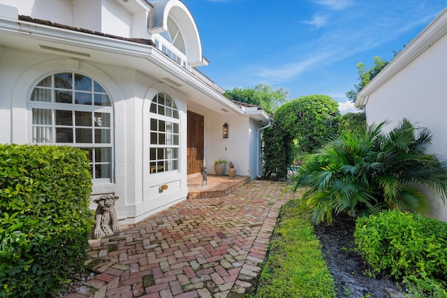 view of property exterior with a patio area