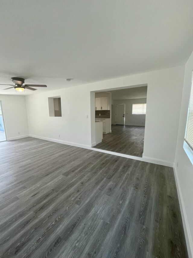 spare room featuring dark hardwood / wood-style floors and ceiling fan