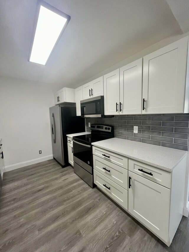 full bathroom featuring toilet, tiled shower / bath combo, vanity, and tile patterned flooring