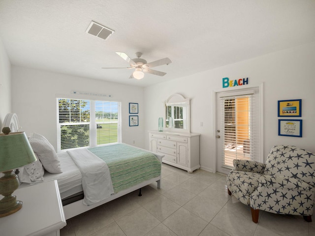 bedroom with access to outside, ceiling fan, and light tile patterned floors