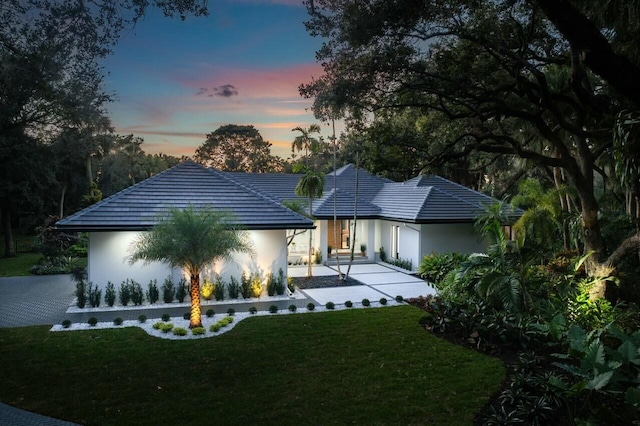 view of front of home with a yard