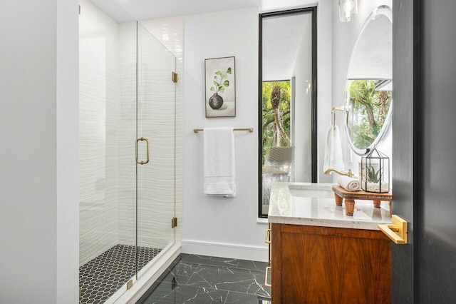 16436 Bridlewood Cir E, Delray Beach, FL 33445 - bathroom with marble finish floors, vanity, a shower stall, and baseboards
