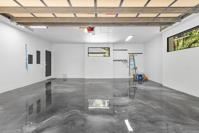 16436 Bridlewood Cir E, Delray Beach, FL 33445 - garage featuring electric panel and a garage door opener