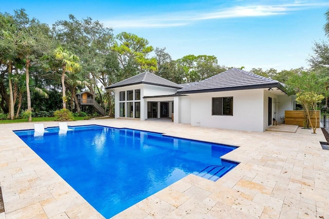 view of swimming pool with a patio