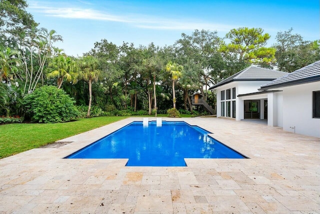 view of swimming pool featuring a patio