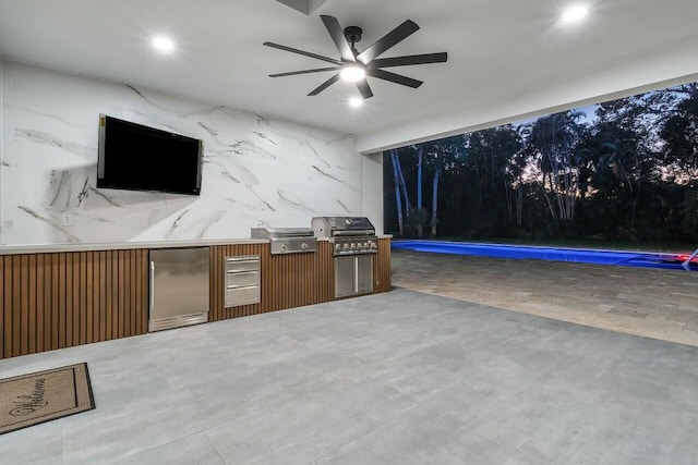 view of patio featuring area for grilling, grilling area, and ceiling fan