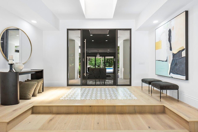 entryway with wood-type flooring