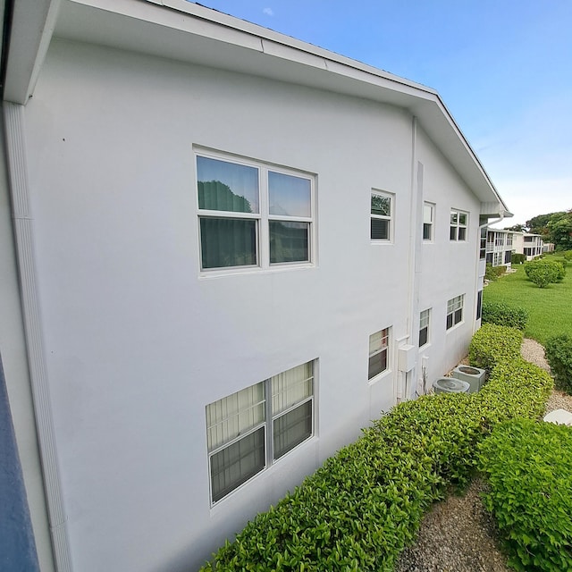 view of side of property featuring stucco siding