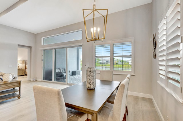 dining room featuring a chandelier and light hardwood / wood-style floors