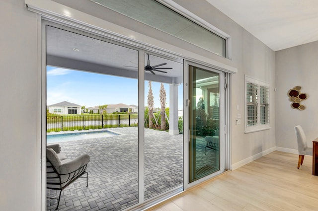 entryway with light hardwood / wood-style flooring and ceiling fan