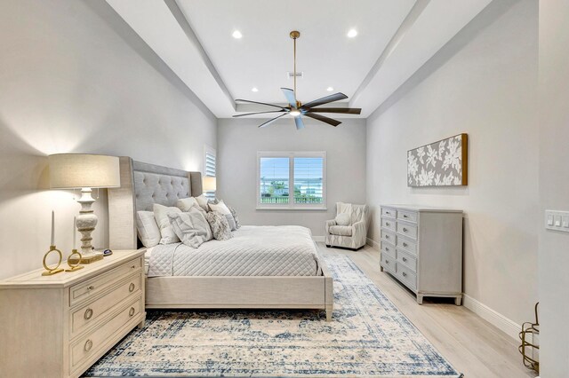 bedroom featuring light hardwood / wood-style flooring and ceiling fan