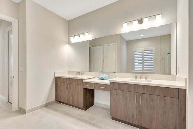 bathroom featuring tile patterned flooring and vanity