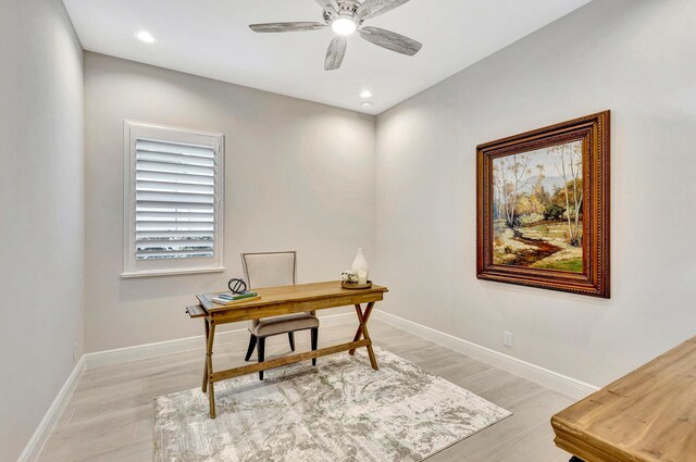 office space featuring light wood-type flooring and ceiling fan