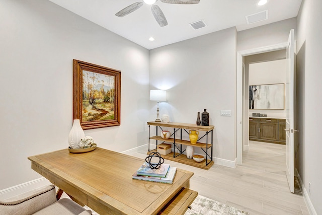 office featuring ceiling fan and light wood-type flooring