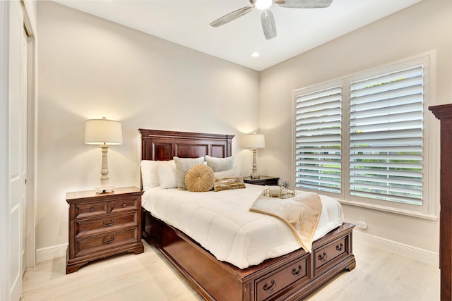 bedroom featuring a closet, ceiling fan, and light hardwood / wood-style flooring