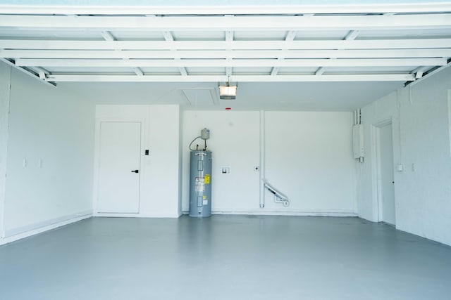 garage featuring water heater and a garage door opener