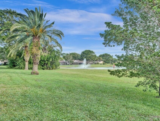 9264 Vista Del Lago Unit H, Boca Raton, FL 33428 - rear view of property with stucco siding, a yard, and stairway
