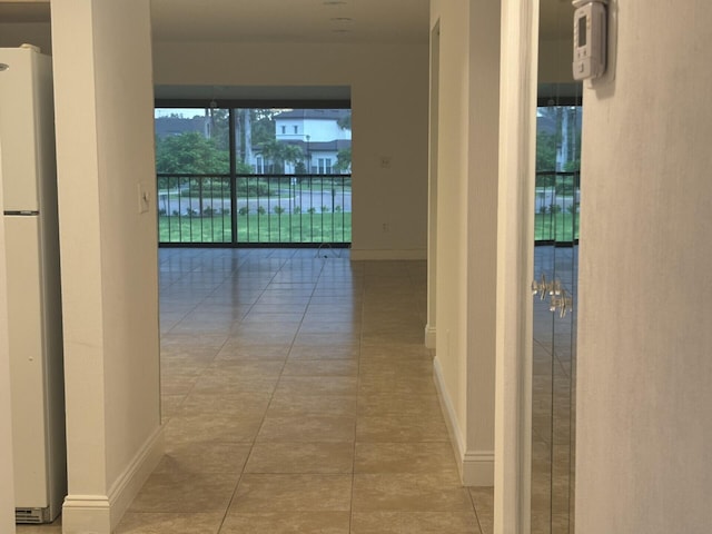 corridor featuring tile patterned flooring