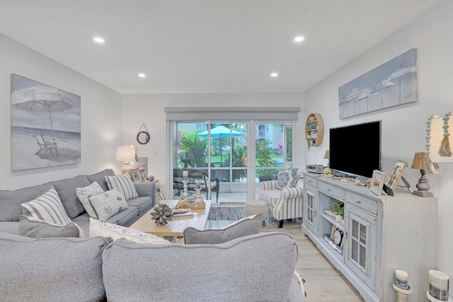 living room with light hardwood / wood-style flooring