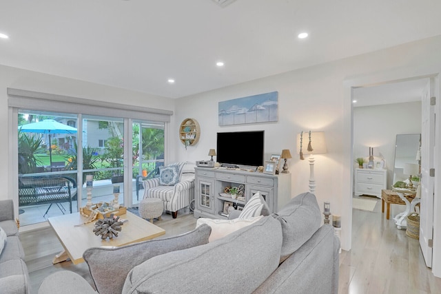 living room with light hardwood / wood-style floors