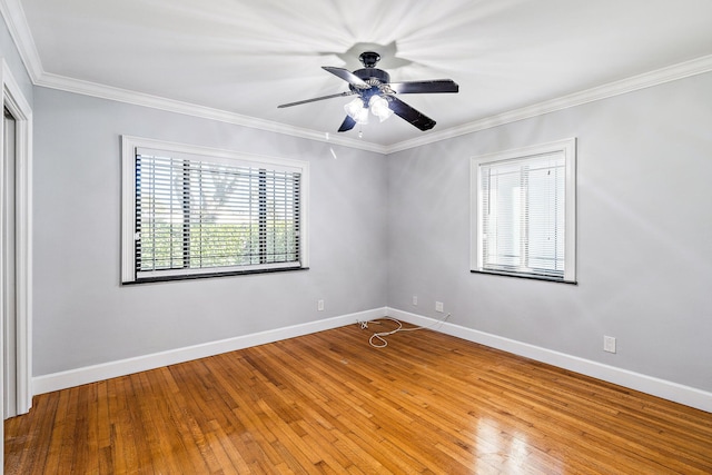 504 51st St, West Palm Beach, FL 33407 - unfurnished room featuring plenty of natural light, ornamental molding, hardwood / wood-style floors, and baseboards