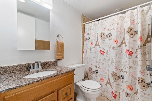 bathroom featuring vanity, toilet, tile patterned floors, and walk in shower