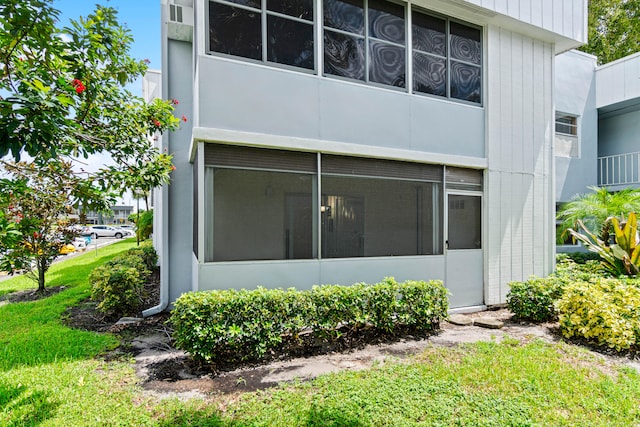 exterior space featuring a sunroom