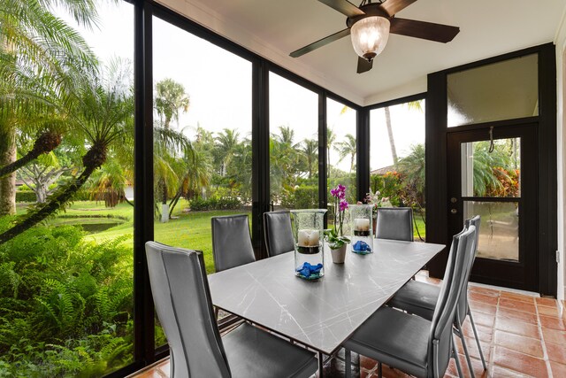 sunroom / solarium with ceiling fan