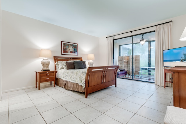 bedroom with light tile patterned floors and access to outside