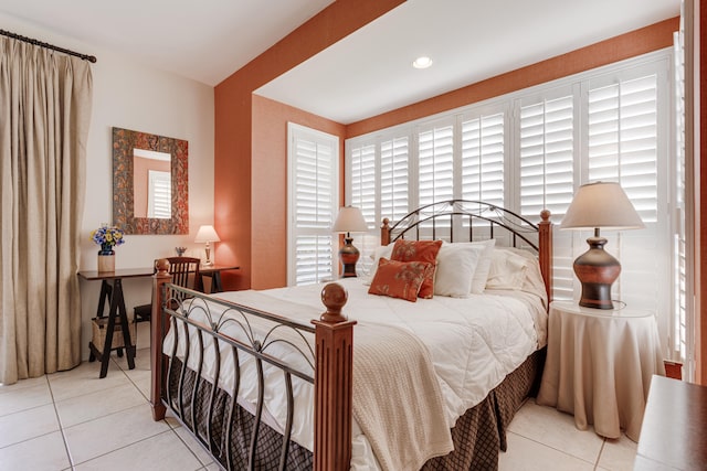 bedroom with light tile patterned floors