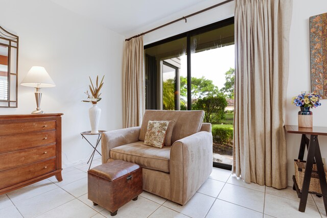 living area featuring light tile patterned flooring