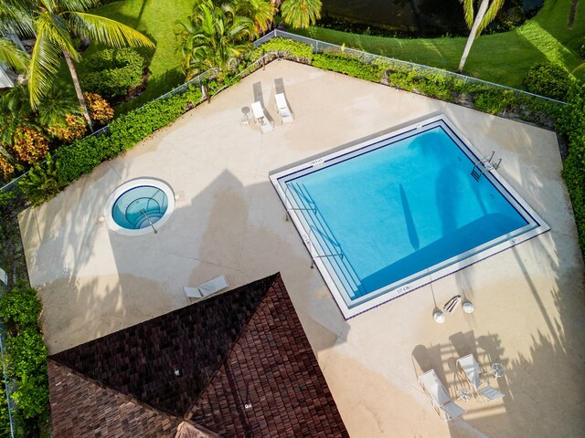 view of swimming pool with a lawn and a patio