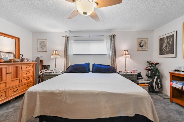 carpeted bedroom with ceiling fan and a textured ceiling