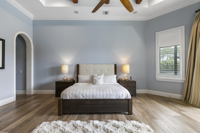 11780 Otter Run, Lake Worth, FL 33449 - bedroom with crown molding, arched walkways, baseboards, wood finished floors, and visible vents