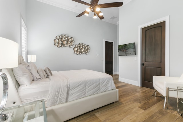 11780 Otter Run, Lake Worth, FL 33449 - bedroom featuring ceiling fan, visible vents, crown molding, wood finished floors, and baseboards
