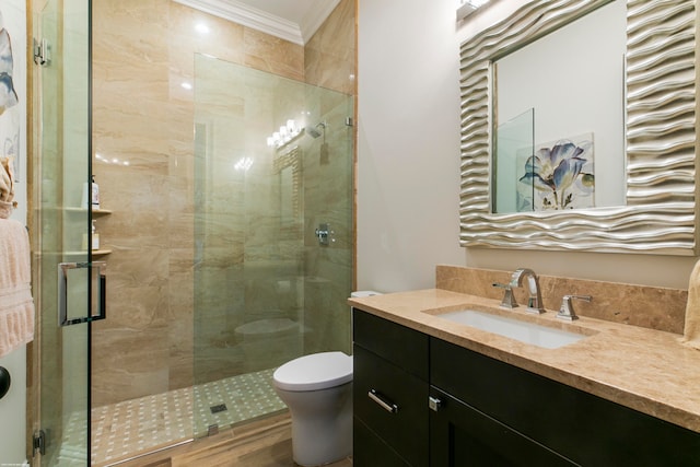 bathroom with vanity, hardwood / wood-style flooring, walk in shower, crown molding, and toilet