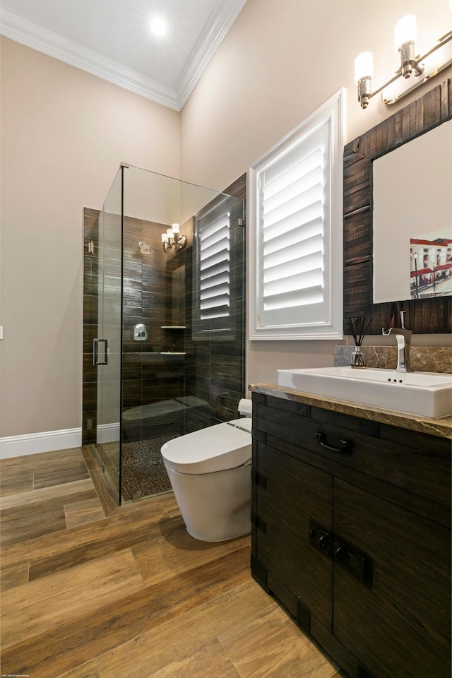 bathroom featuring hardwood / wood-style flooring, vanity, toilet, and an enclosed shower