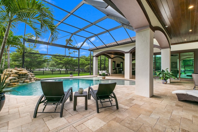11780 Otter Run, Lake Worth, FL 33449 - outdoor pool featuring glass enclosure and a patio area