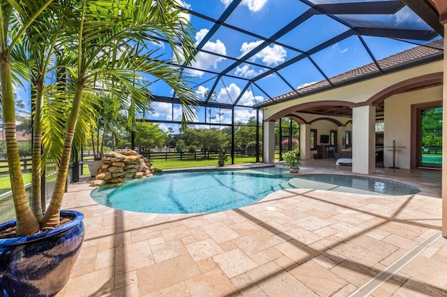 view of pool featuring a patio and a lanai