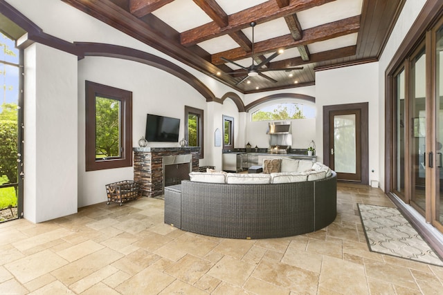 11780 Otter Run, Lake Worth, FL 33449 - living room featuring stone tile flooring, coffered ceiling, beam ceiling, and a fireplace
