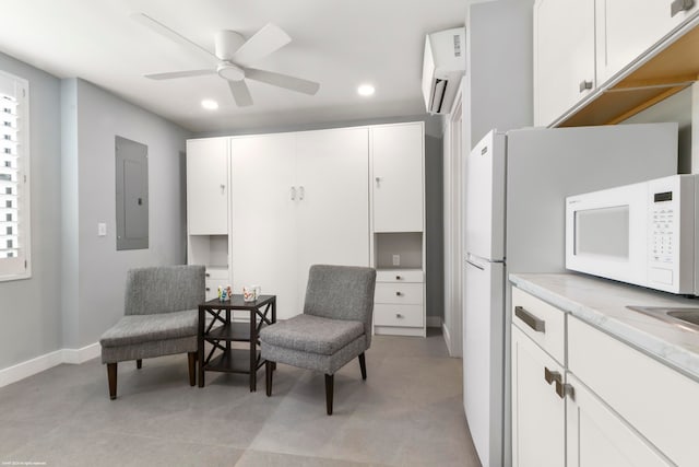 living area featuring electric panel and ceiling fan