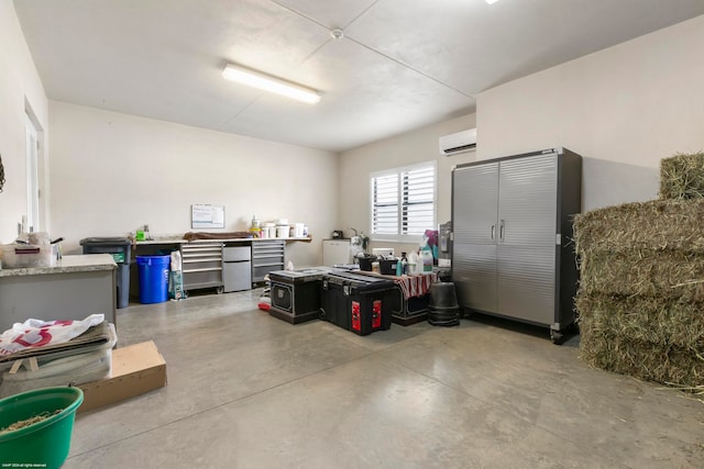 garage featuring a wall mounted AC