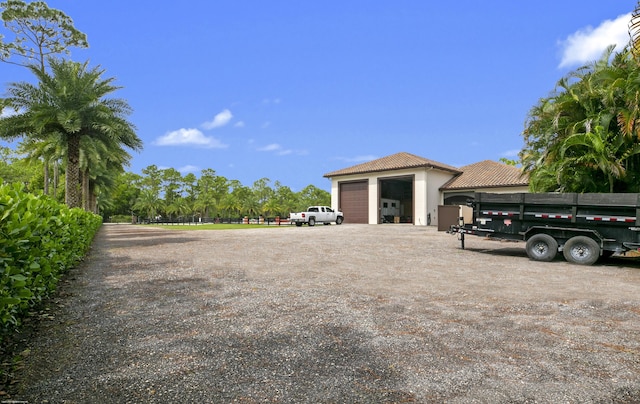 11780 Otter Run, Lake Worth, FL 33449 - exterior space with a garage and driveway
