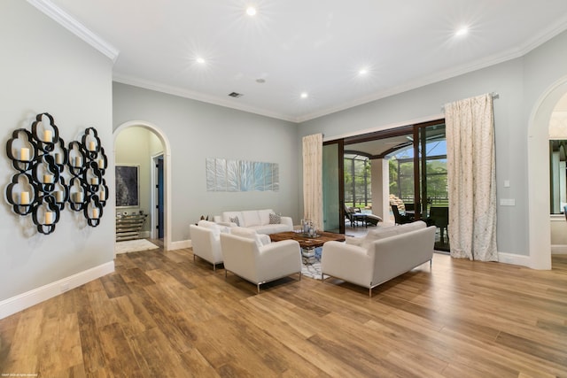 living room featuring light wood-type flooring and ornamental molding