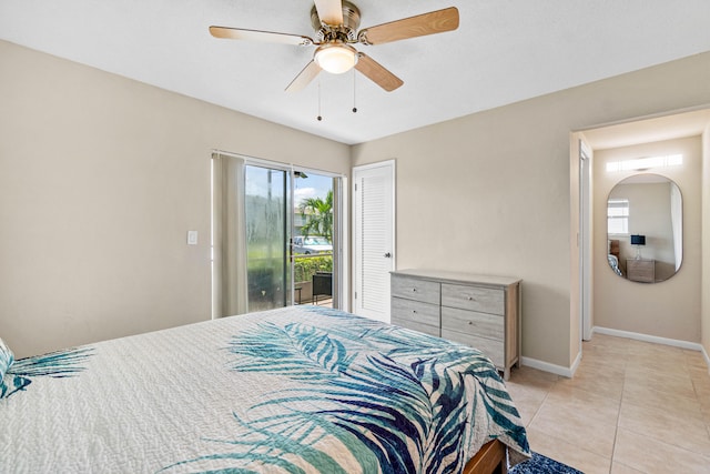 tiled bedroom with ceiling fan and access to outside