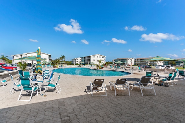 view of swimming pool featuring a patio