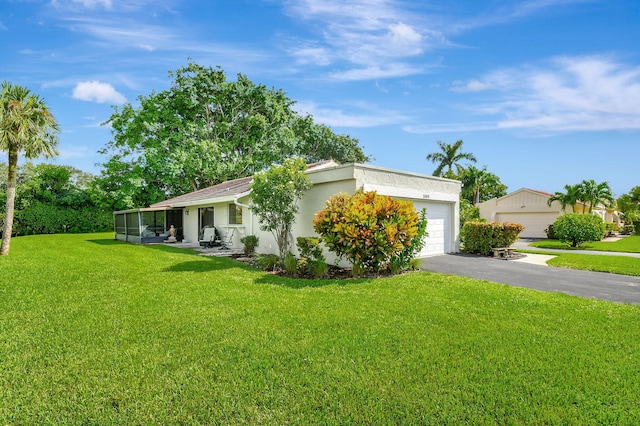 view of front facade featuring a garage and a front lawn