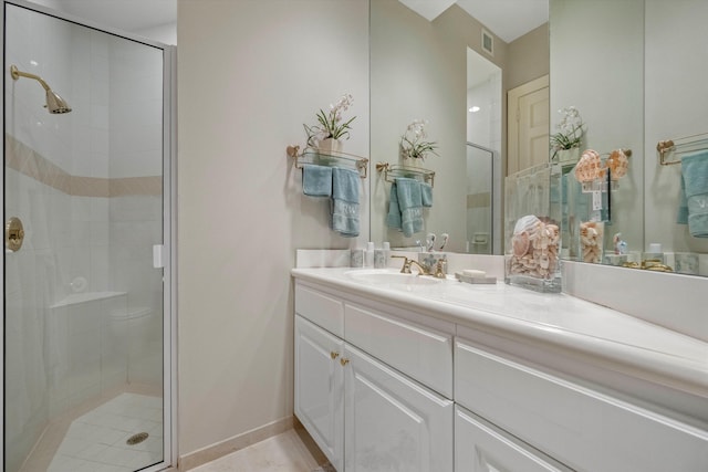 bathroom with vanity, an enclosed shower, and toilet