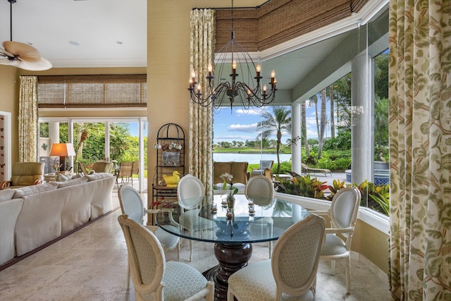 dining space featuring ceiling fan with notable chandelier