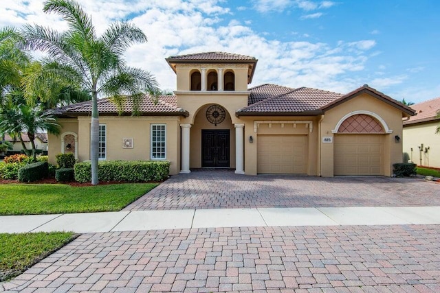 mediterranean / spanish-style house featuring a garage